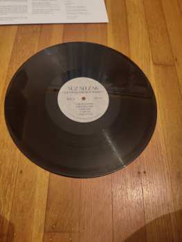 LP Suz Slezak: Our Wings May Be Featherless