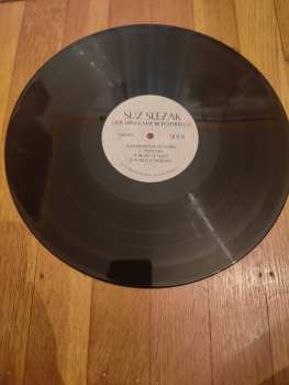 LP Suz Slezak: Our Wings May Be Featherless